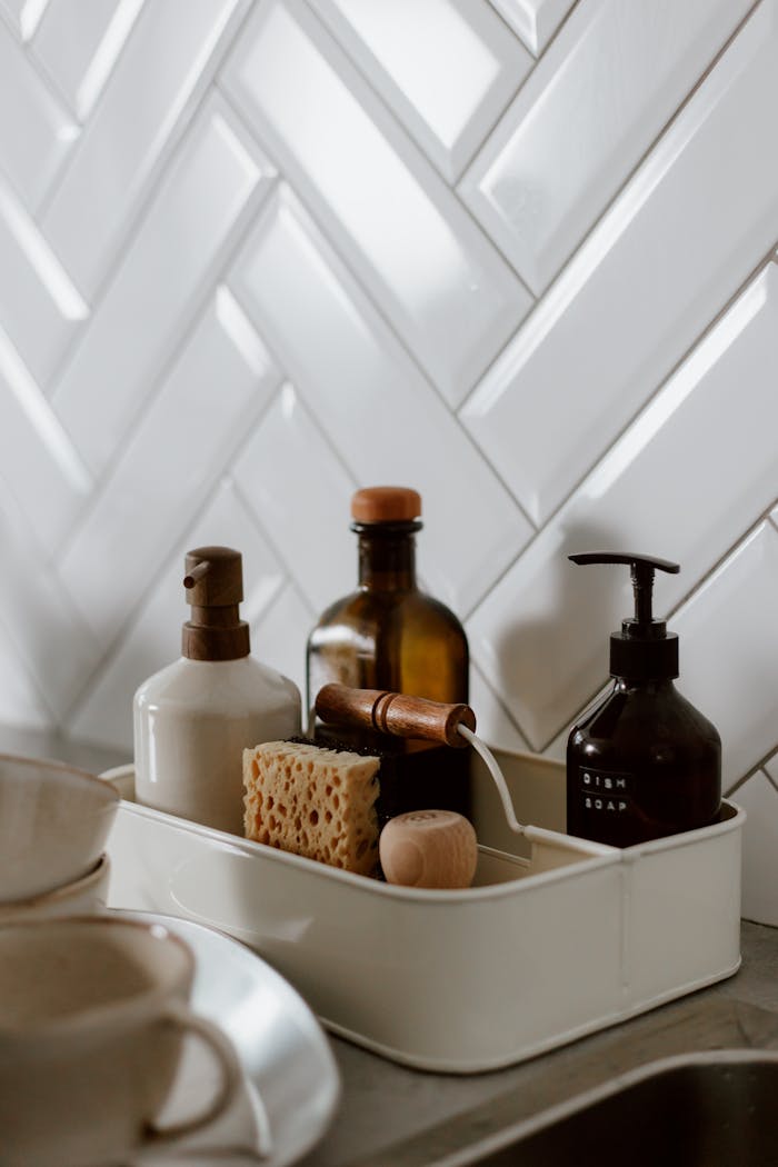 Mastering the First Impression: Your intriguing post title goes here 2 Stylish kitchen counter setup with soap and cleaning supplies in a modern setting.